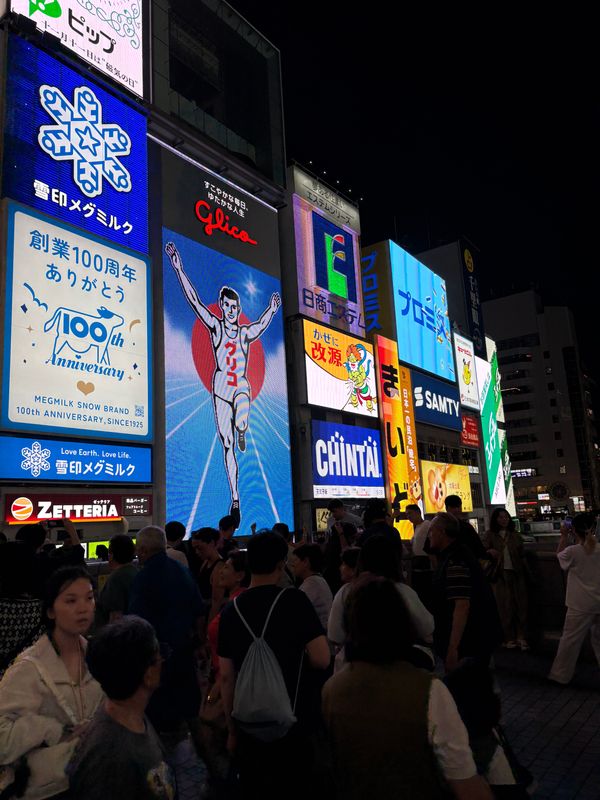 Crowds under the bright billboards of Dōtonbori in Osaka at night